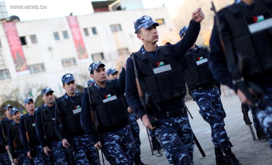 Palestinian police forces deploy in the Manger square outside the Church of the Nativity, traditionally believed to be the birthplace of Jesus Christ, as preparations for Christmas celebrations in the West Bank biblical town of Bethlehem on Dec. 24, 2012. (Xinhua/Fadi Arouri)