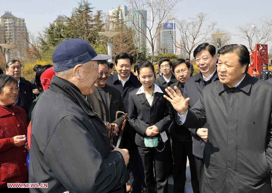 In this file photo taken on March 25, 2009, Liu Yunshan (R, front) talks with citizens of Weifang, east China's Shandong Province. (Xinhua/Zhu Zheng) 