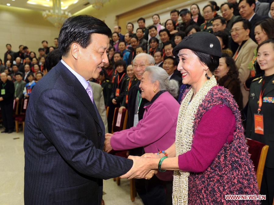 In this file photo taken on Dec. 1, 2010, Liu Yunshan (L, front), then a member of the Political Bureau of the Communist Party of China (CPC) Central Committee, also a member of the Secretariat of the CPC Central Committee and head of the Publicity Department of the CPC Central Committee, shakes hands with representatives attending the Ninth National Congress of the China Dancers Association before the opening ceremony of the congress in Beijing, capital of China. (Xinhua/Li Tao)  