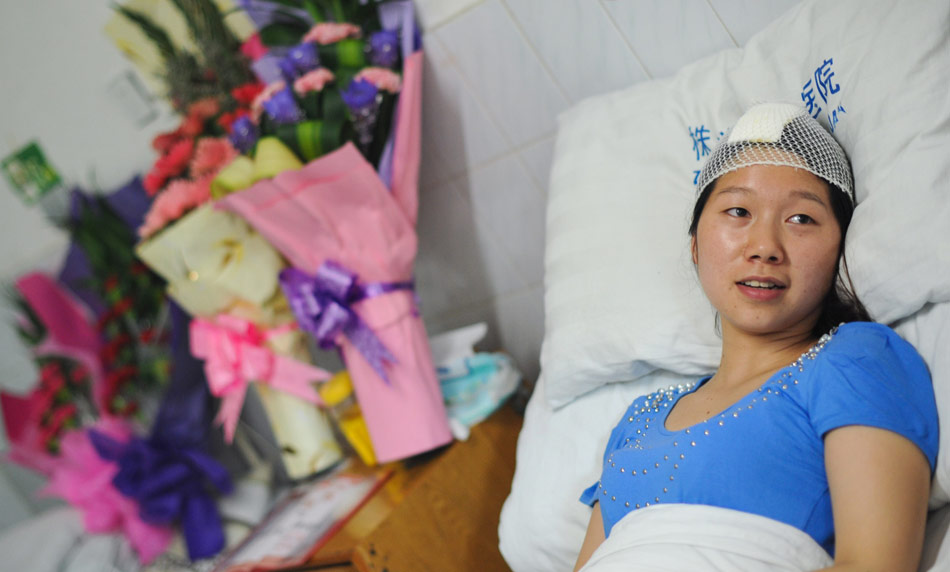 He Yao lies on the bed in the ward in a hospital in Zhuzhou, Hunan on May 7, 2012.