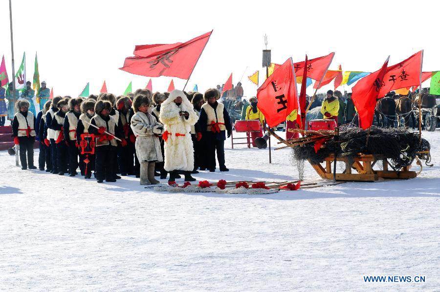 Local fishermen perform sacrifice ceremony ahead of breaking ice and netting fish in the Chagan Lake in Qian Gorlos Mongolian Autonomous County, northeast China's Jilin Province, Dec. 27, 2012. (Xinhua/Ma Caoran)
