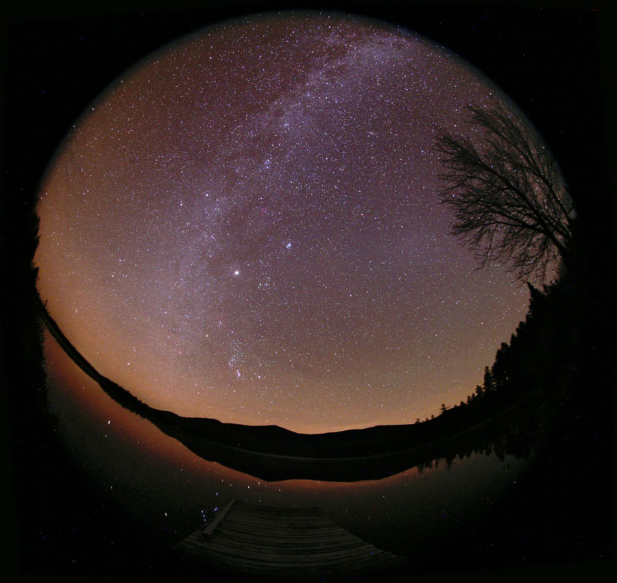 Zodiacal Light and Milky Way. Ghostly apparitions of two fundamental planes in planet Earth's sky span this October all-sky view. The scene was captured from a lakeside campsite under dark skies in northern Maine, USA. In it, the plane of our Milky Way Galaxy arcs above faint airglow along the horizon. (Photo/ NASA)