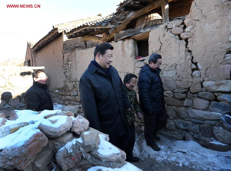 Xi Jinping (L, front), general secretary of the Communist Party of China (CPC) Central Committee and chairman of the CPC Central Military Commission, visits the family of Tang Zongxiu (C, front), an impoverished villager in the Luotuowan Village of Longquanguan Township, Fuping County, north China's Hebei Province, Dec. 30, 2012. Xi made a tour to impoverished villages in Fuping County from Dec. 29 to 30, 2012. (Xinhua/Pang Xinglei) 