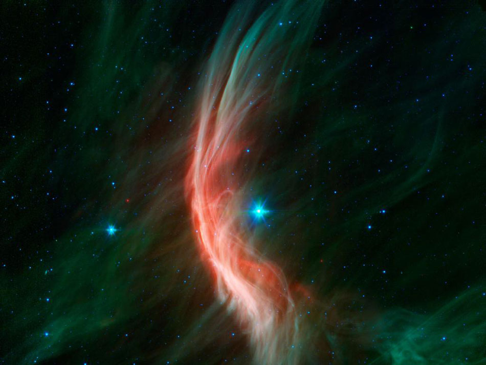 Zeta Oph: Runaway Star. Like a ship plowing through cosmic seas, runaway star Zeta Ophiuchi produces the arcing interstellar bow wave or bow shock seen in this stunning infrared portrait. In the false-color view, bluish Zeta Oph, a star about 20 times more massive than the Sun, lies near the center of the frame, moving toward the left at 24 kilometers per second. (Photo/ NASA)
