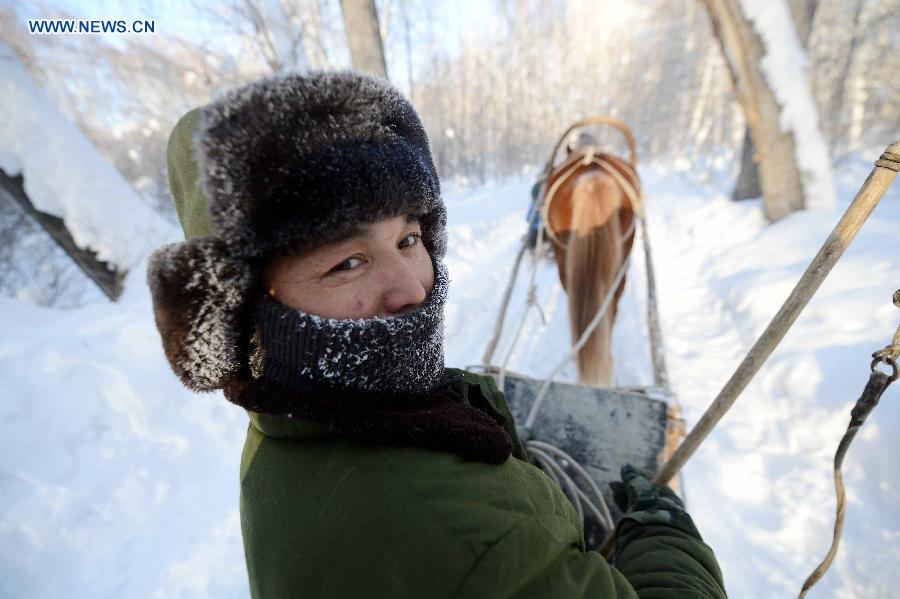 A herdsman of Kazak ethnic group controls a sledge dragged by a horse after snowfall in Altay, northwest China's Xinjiang Uygur Autonomous Region, Dec. 28, 2012. Beautiful snow scenery here attracts a good many tourists. (Xinhua/Sadat)