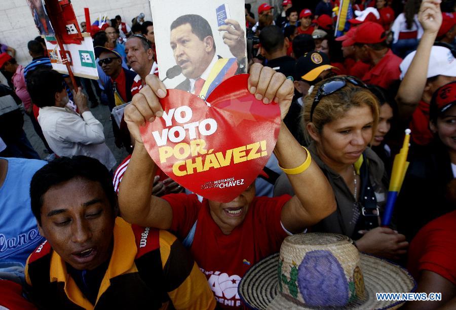 Supporters of Venezuelan President Hugo Chavez participate during a demonstration outside the National Assembly, in Caracas, Venezuela, on Jan. 5, 2013. Venezuelan Vice President Nicolas Maduro said Friday that ailing President Hugo Chavez could be sworn in by the Supreme Court at a later date if he is not able to take the oath of office as scheduled on Jan. 10. (Xinhua/Juan Carlos Hernandez) 