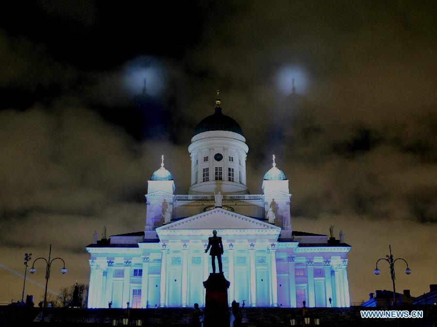 A cathedral is illuminated on the senate square in Helsinki, capital of Finland, on Jan. 6, 2013. Epiphany is celebrated here with an art slide show. (Xinhua/Li Jizhi)