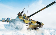 Armored regiment in drill on snow-capped plateau