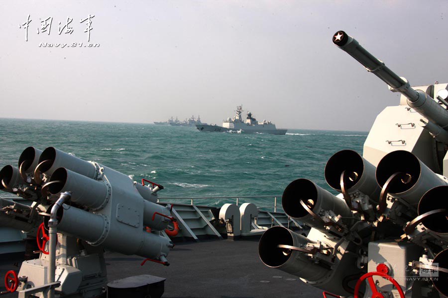 Warships of the East Sea Fleet under the Navy of the Chinese People's Liberation Army (PLA) conducts an offensive-and-defensive drill in a sea area, in a bid to improve troops' actual combat and emergency-handling capability. (navy.81.cn/Fang Lihua, Liu Yaxun)