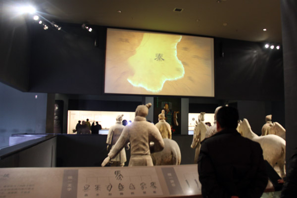Visitors watch videos on the history of the Qin Dynasty at the Shaanxi History Museum on January 11, 2013. (CRIENGLISH.com/Liu Kun)