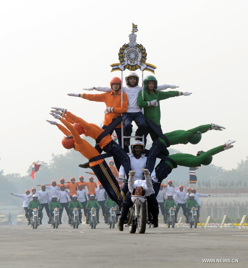 Indian army soldiers perform a stunt on motorcycles during the army day parade in New Delhi, capital of India, Jan. 15, 2013. (Xinhua/Partha Sarkar)