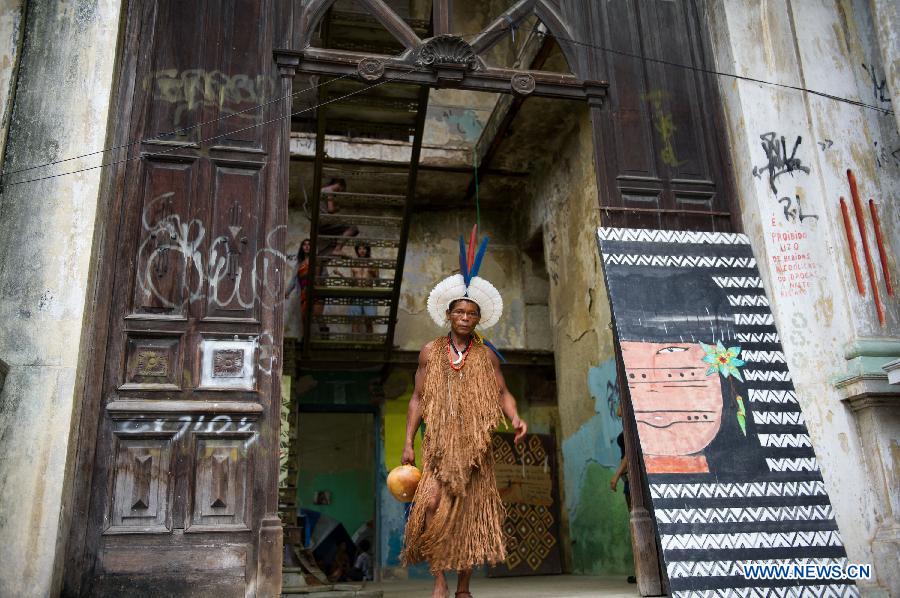 An indigenous man walks out of the old Indian Museum in Rio de Janeiro, Brazil, Jan. 16, 2013. The government of Rio de Janeiro plans to tear down an old Indian museum beside Maracana Stadium to build parking lot and shopping center here for the upcoming Brazil 2014 FIFA World Cup. The plan met with protest from the indigenous groups. Now Indians from 17 tribes around Brazil settle down in the old building, appealing for the protection of the century-old museum, the oldest Indian museum in Latin America. They hope the government could help renovate it and make part of it a college for indigenous Indians. (Xinhua/Weng Xinyang) 