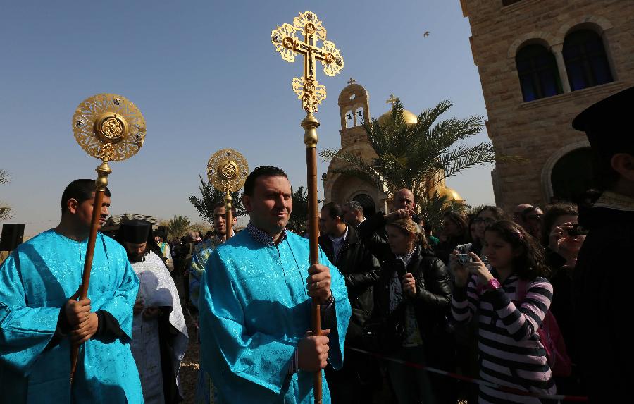 Christian priests attend a mass at a baptism site by the Jordan River on Jan. 18, 2013. Thousands of Orthodox Christians flocked to the baptism site on Friday to start a pilgrimage. (Xinhua/Mohammad Abu Ghosh) 