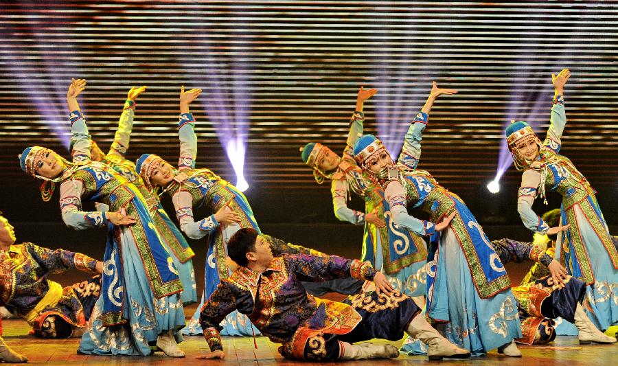 Dancers perform during a variety show for the Snow and Ice Culture Festival in Xilinhot City, north China's Inner Mongolia Autonomous Region, Jan. 18, 2013. The festival will last from Jan. 18 to Feb. 25. (Xinhua/Zhao Tingting)