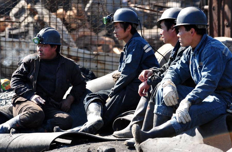 Rescuers rest at the accident site after a coal and gas outburst occurred at the Jinjia Coal Mine under the Panjiang Investment Holding Group in southwest China's Guizhou Province, Jan. 19, 2013. The accident, which happened Friday afternoon, has left two people dead and 11 others trapped. (Xinhua/Yang Ying) 