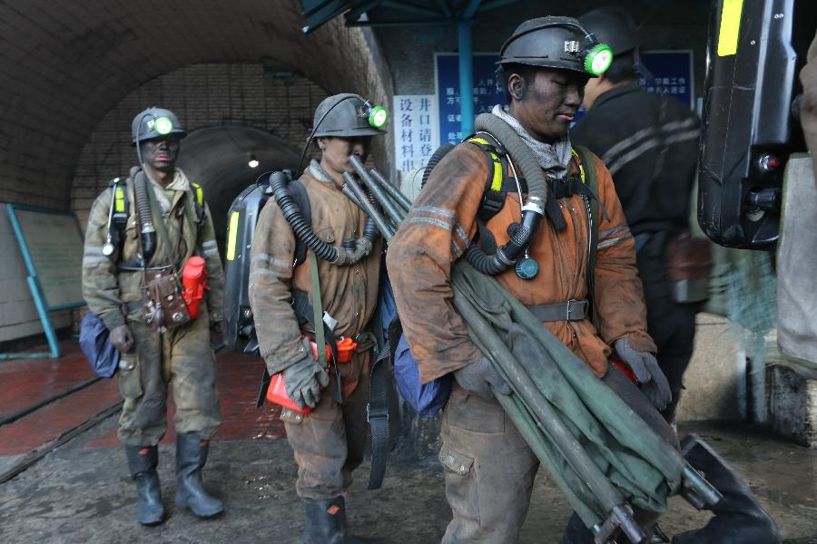 Rescuers are seen at the accident site after a coal and gas outburst occurred at the Jinjia Coal Mine under the Panjiang Investment Holding Group in southwest China's Guizhou Province, Jan. 19, 2013. The accident, which happened Friday afternoon, has left two people dead and 11 others trapped. (Xinhua/Huang Shujin) 