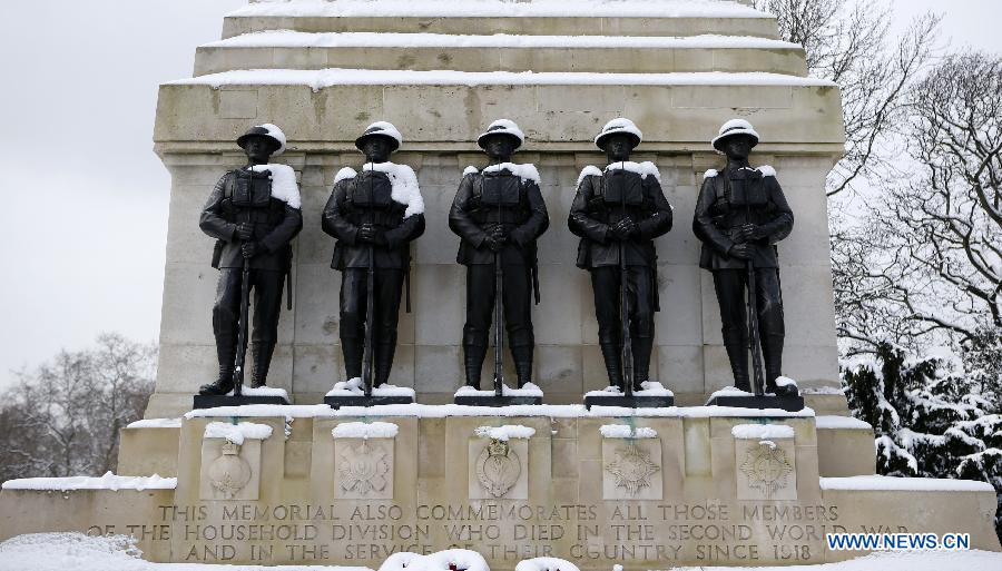 Snow-covered the Guards Memorial is seen after a snowfall in London, Britain, Jan. 21, 2013. (Xinhua/Wang Lili)