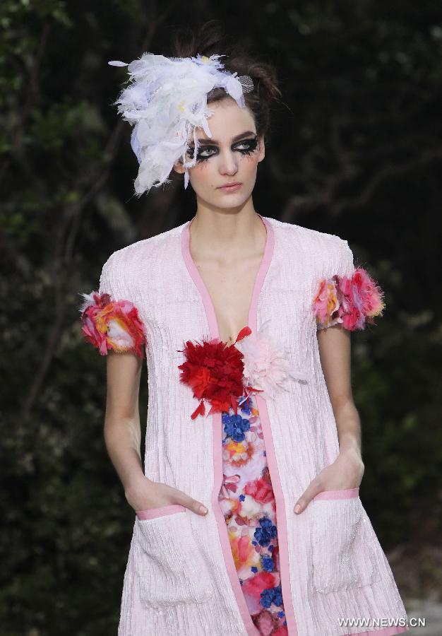 A model presents a creation by German designer Karl Lagerfeld for French fashion house Chanel during the Haute Couture Spring-Summer 2013 collection shows in Paris, France, Jan. 22, 2013. (Xinhua/Gao Jing) 