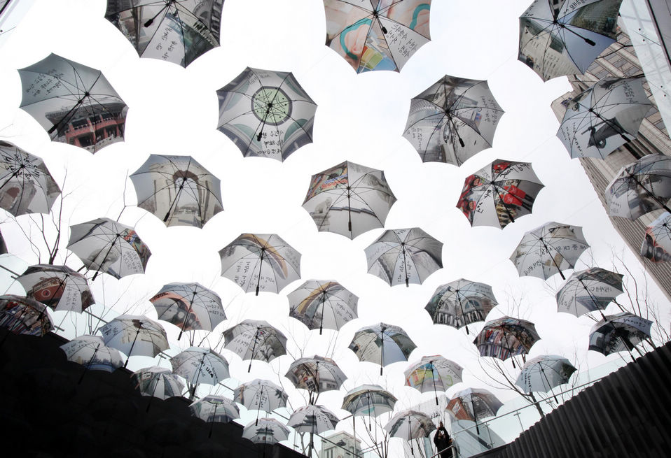 Umbrellas are displayed in front of Seoul City Hall in Seoul, South Korea, Jan. 22, 2013. The display symbolizes Seoul public officials' intention to be an umbrella for Seoul citizens. (Xinhua/AP)
