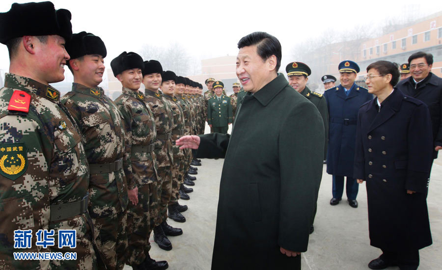 Xi Jinping (C, front), general secretary of the Central Committee of the Communist Party of China (CPC) and also chairman of the CPC Central Military Commission, talks with members of the 13th detachment of the Beijing contingent of Chinese People's Armed Police Force in Beijing, capital of China, Jan. 29, 2013.  (Xinhua/Li Gang)