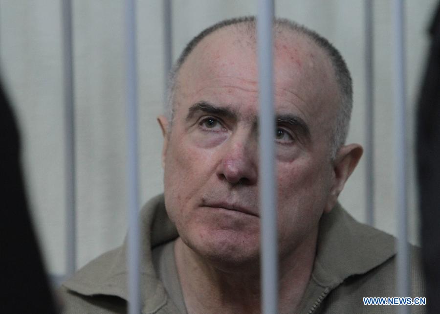 Former chief of the External Surveillance Department of the Ukrainian Interior Ministry Aleksey Pukach is seen during his trial at Pecherskiy District Court in Kiev, Ukraine, Jan. 29, 2013. Pukach was found guilty of killing Ukrainian opposition journalist Georgy Gongadze in 2000 and sentenced to life imprisonment by the court in Kiev on Tuesday. (Xinhua/Sergey Starostenko)