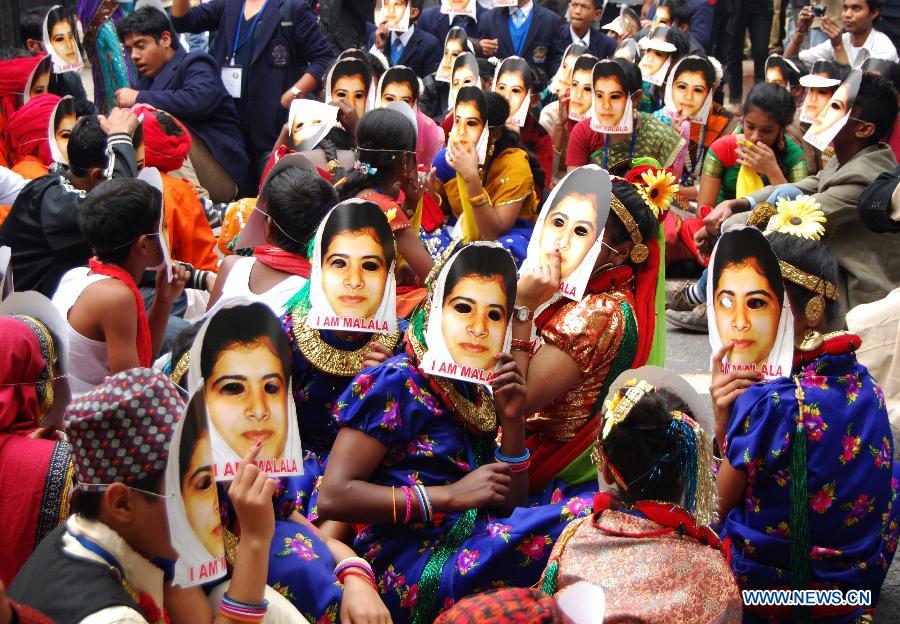 Indian students wear masks of Malala Yousufzai, a 15-year-old girl who was shot at close range in the head by a Taliban gunman in Pakistan, during a campaign to demand better budgetary allocation for health and education of Indian children in New Delhi, India, Feb. 2, 2013. (Xinhua/Partha Sarkar)