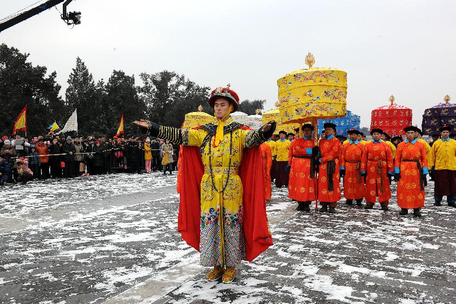 A performer dressed in costume of an emperor of the Qing Dynasty (1644-1911) acts during a rehearsal of a performance presenting the ancient royal ritual to worship heaven at the Temple of Heaven in Beijing, capital of China, Feb. 5, 2013. 