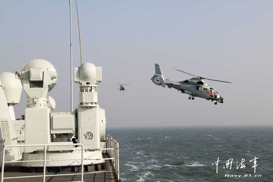 A ship-borne aircraft troop unit of the aviation force under the North China Sea Fleet of the Navy of the Chinese People's Liberation Army (PLA) successfully completed high-intensity landing training for twelve uninterrupted hours recently for the first time and greatly enhanced troop unit's capabilities of ship-helicopter coordination as well as diversified-task performing under complicated weather conditions. (China Military Online/Hu Baoliang)