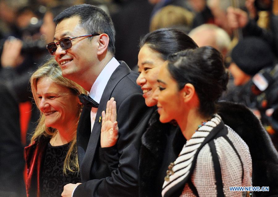 (From L)American director Ellen Kuras, Chinese director Wong Kar Wai, Wong Kar Wai's wife and Irani director Shirin Neshat pose on the red carpet upon arrival for the opening ceremony of the 63rd Berlin film festival in Berlin, Germany, on Feb. 7, 2013. The 63rd Berlin film festival opened Thursday with a martial arts epic "The grandmaster" of Chinese director Wong Kar Wai who will also lead the jury of this Berlinale. (Xinhua/Ma Ning)