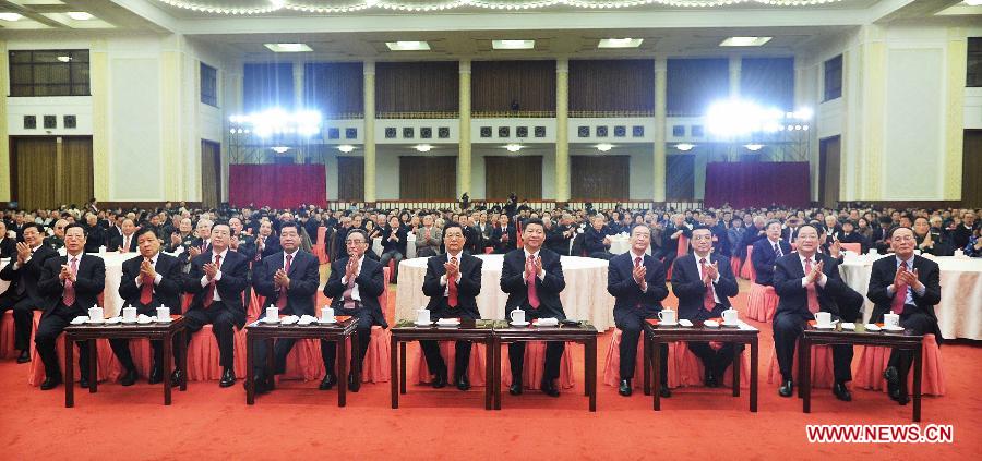 Chinese leaders Hu Jintao (C), Xi Jinping (5th R), Wu Bangguo (5th L), Wen Jiabao (4th R), Jia Qinglin (4th L), Li Keqiang (3rd R), Zhang Dejiang (3rd L), Yu Zhengsheng (2nd R), Liu Yunshan (2nd L), Wang Qishan (1st R) and Zhang Gaoli (1st L) attend a Spring Festival reception held by the Central Committee of the Communist Party of China and the State Council (Cabinet) at the Great Hall of the People in Beijing, capital of China, Feb. 8, 2013. (Xinhua/Li Tao) 