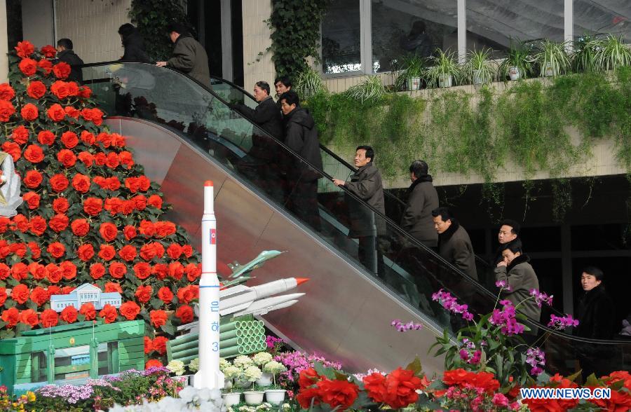 People visit a flower exhibition named after late leader Kim Jong Il in Pyongyang, capital of the Democratic People's Republic of Korea (DPRK), Feb. 15, 2013. (Xinhua/Du Baiyu)