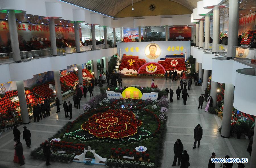 People visit a flower exhibition named after late leader Kim Jong Il in Pyongyang, capital of the Democratic People's Republic of Korea (DPRK), Feb. 15, 2013. (Xinhua/Du Baiyu)