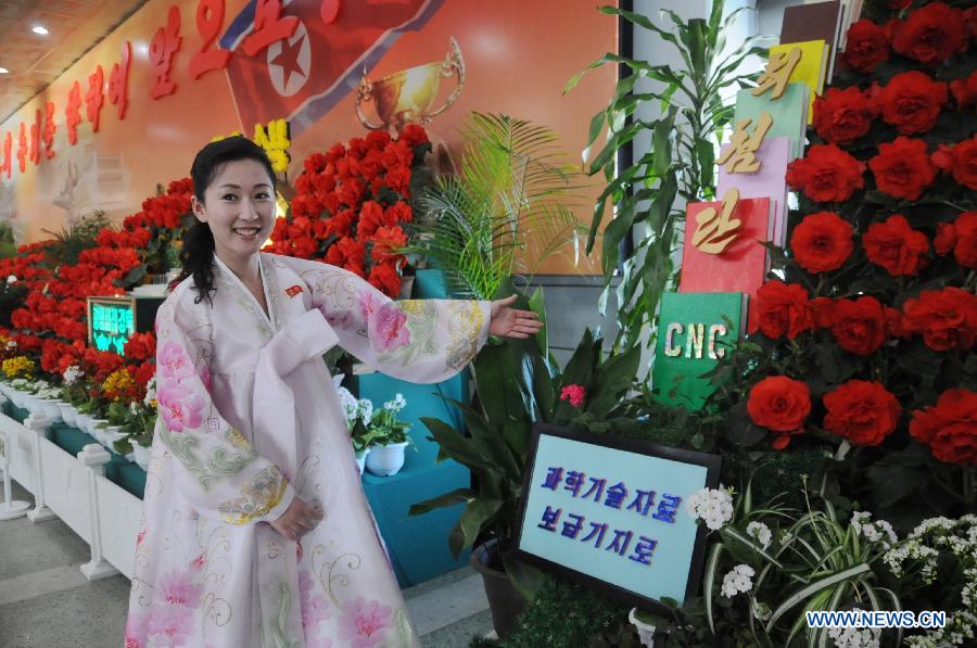 A woman visits a flower exhibition named after late leader Kim Jong Il in Pyongyang, capital of the Democratic People's Republic of Korea (DPRK), Feb. 15, 2013. (Xinhua/Du Baiyu)