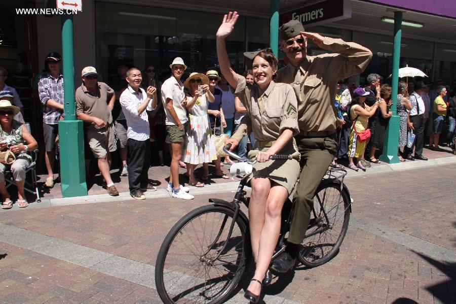 A vintage bike is seen in the Vintage Car Parade in Napier, New Zealand, Feb. 16, 2013. More than 300 vintage cars joined the parade, the highlight of the annual Art Decor Weekend festival. (Xinhua/Liu Jieqiu)