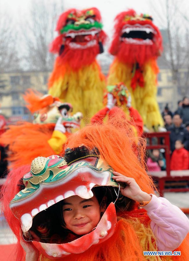 File photo taken on Feb. 27, 2010 shows a young folk artist attending a Lantern Festival Shehuo performance in Zhengzhou, capital of central China's Henan Province. (Xinhua/Wang Song)