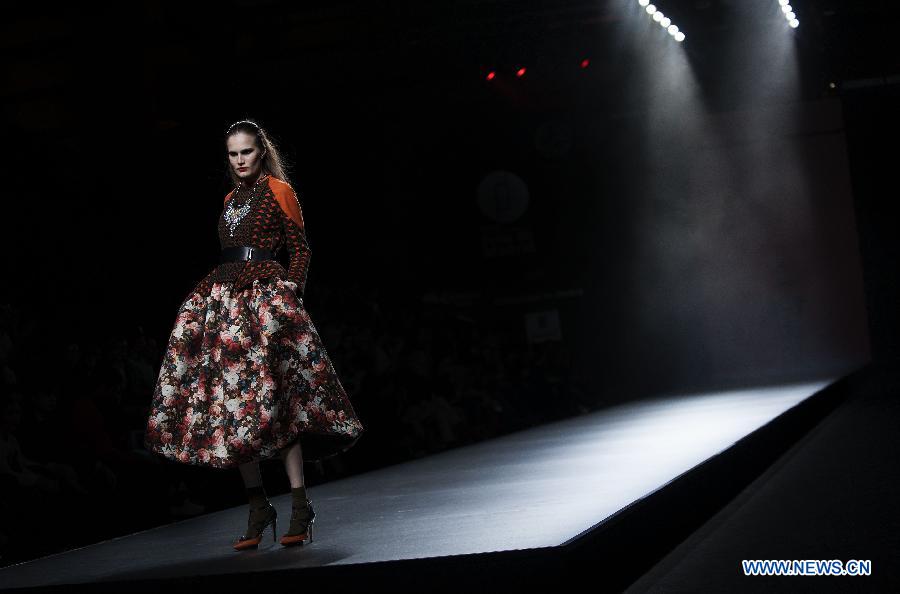 A model presents a creation by Teresa Helbig during Madrid Fashion Week in Madrid, Spain, on Feb. 18, 2013. (Xinhua/Xie Haining) 