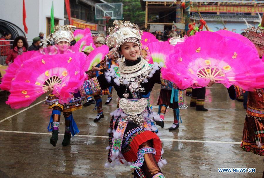 Ye Ziwen of Miao ethnic group dances during a traditional gathering between villages to mark the Spring Festival, or Chinese Lunar New Year, at Antai Township in Rongshui Miao Autonomous County, south China's Guangxi Zhuang Autonomous Region, Feb. 21, 2013. (Xinhua/Zhang Ailin) 