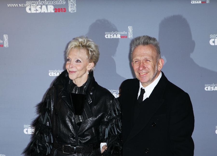Fashion designer Jean-Paul Gaultier (R) and French director Tonie Marshall arrive at the 38th annual Cesar awards ceremony held at the Chatelet Theatre in Paris, France, Feb. 22, 2013. (Xinhua/Gao Jing) 