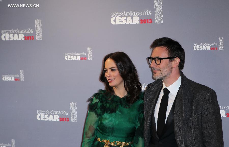 French actress Berenice Bejo (L) and French director Michel Hazanavicius (R) arrive at the 38th annual Cesar awards ceremony held at the Chatelet Theatre in Paris, France, Feb. 22, 2013. (Xinhua/Gao Jing) 