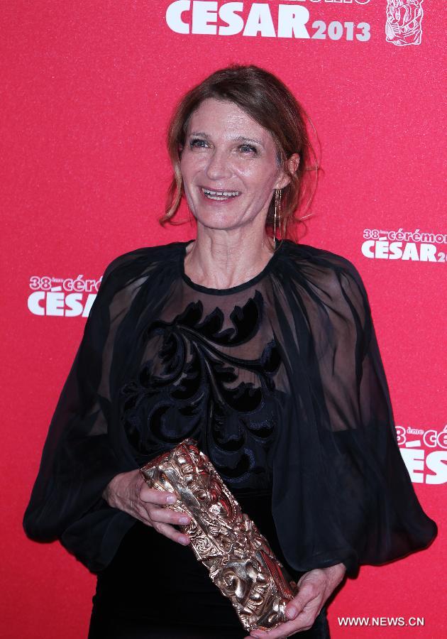 Katia Wyszkop poses with her Best Production Design award for 'Les Adieux a la Reine' during the 38th annual Cesar awards ceremony held at the Chatelet Theatre in Paris, France, Feb. 22, 2013.(Xinhua/Gao Jing)
