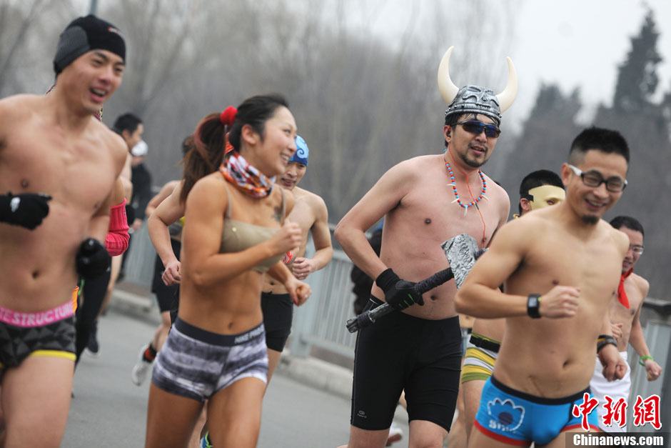 People in underwear participate in a long-distance run to promote environmentally friendly lifestyle at the Olympic Forest Park in Beijing, February 25, 2013. (Source: Chinanews.com/Zhang Longyun)