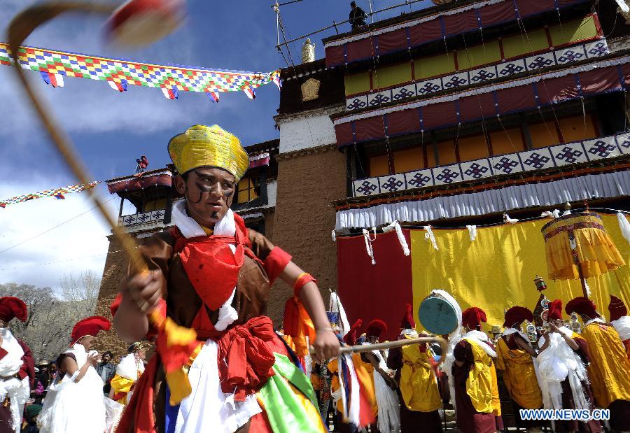A monk performs religious dance "Aqiangmu" during a prayer at the Qoide Monastery in Gonggar County of Shannan Prefecture, southwest China's Tibet Autonomous Region, Feb. 25, 2013. A prayer event was held here Monday, which is the 15th day of January in the Tibetan calendar, marking the end of the Tibetan new year. (Xinhua/Chogo)
