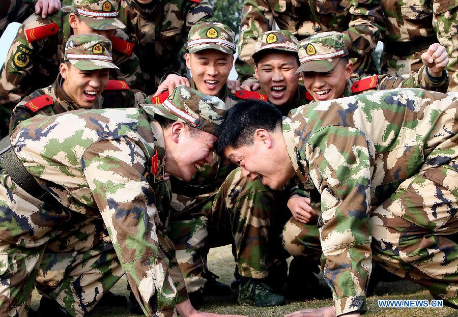 Members of Chinese People's Armed Police Force are seen having a folk competition at a training break in Shanghai, east China, Feb. 25, 2013. (Xinhua/Chen Fei) 