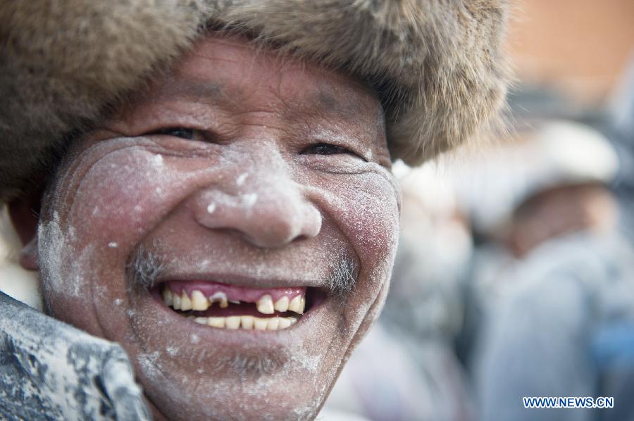A man with tsampa on his face takes part in a celebrational "tsampa fight" in Shigatse of southwest China's Tibet Autonomous Region, Feb. 25, 2013. A "tsampa fight", in which participants cast tsampa (roasted barley flour) at each others to pray for good harvest, was held here on the 15th day of January in the Tibetan calendar, marking the end of the Tibetan new year celebration. (Xinhua/Purbu Zhaxi) 