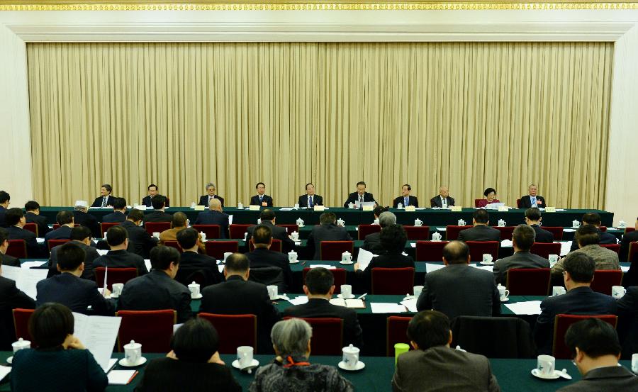 The presidium of the first session of the 12th National Committee of the Chinese People's Political Consultative Conference (CPPCC) hold their first meeting at the Great Hall of the People in Beijing, capital of China, March 2, 2013. (Xinhua/Li Xueren)