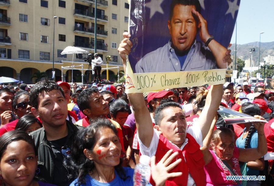 Residents participate in a demonstration in support of Venezuelan President Hugo Chavez at O'Leary Square in Caracas, capital of Venezuela, on March 3, 2013. (Xinhua/AVN) 
