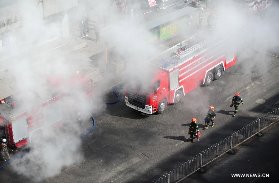 Firefighters work at the accident site after a gas explosion occurred in an underground shopping street in Shenyang, capital of northeast China's Liaoning Province, March 4, 2013. More than 20 workers were injured in the explosion triggered by a gas leak from underground pipelines at a construction site in the underground shopping street in front of a shopping mall on Monday morning. Some 40 workers were at the scene at the time of the explosion. (Xinhua/Pan Yulong)