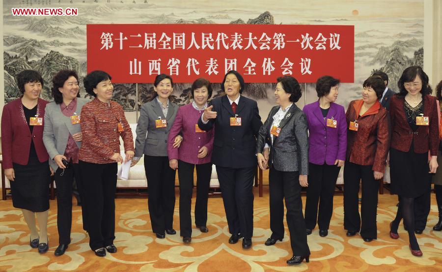 Female deputies to the 12th National People's Congress (NPC) pose for a photo to mark the International Women's Day at the Great Hall of the People in Beijing, capital of China, March 8, 2013. Women's presence in China's politics has been increasing in recent decades. The number of female deputies to the 12th National People's Congress and members of the 12th National Committee of the Chinese People's Political Consultative Conference (CPPCC) rise to 699 and 399, reaching 23.4% and 18.4% of the total respectively. (Xinhua/Xie Huanchi) 