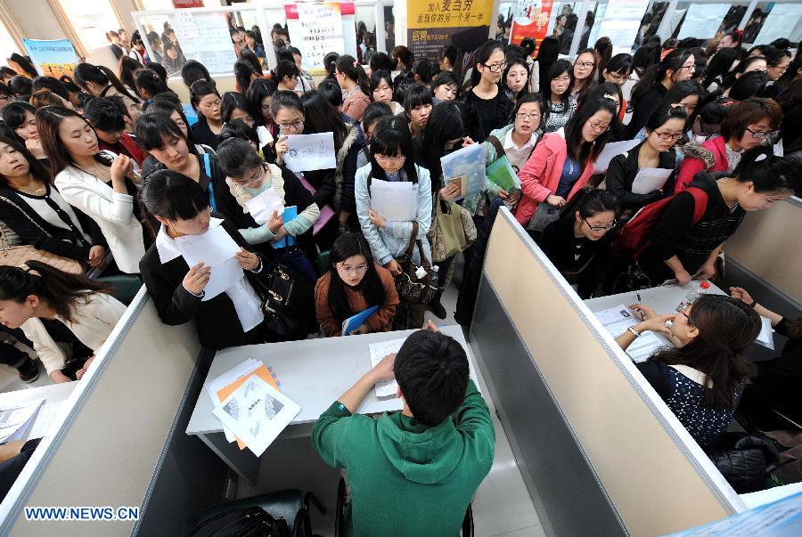 College students are seen during a job fair specially held for females in Nanjing, capital of east China's Jiangsu Province, March 9, 2013. A job fair for female college students were held here on Saturday, providing more than 3,000 positions from some 100 employers. (Xinhua/Sun Can)