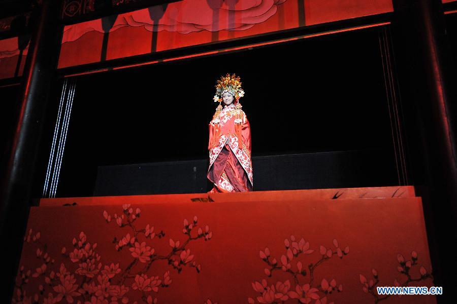 An actress performs in a drama in Pingyao of north China's Shanxi Province, March 9, 2013. (Xinhua/Zhan Yan)